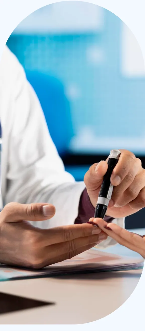 A provider checking a patient's blood sugar